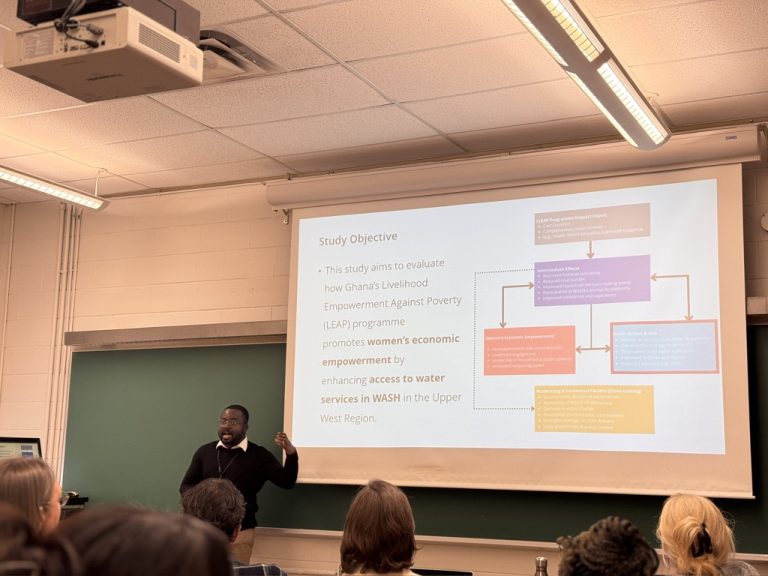 A lab member presenting research on Ghana’s LEAP programme and women’s economic empowerment