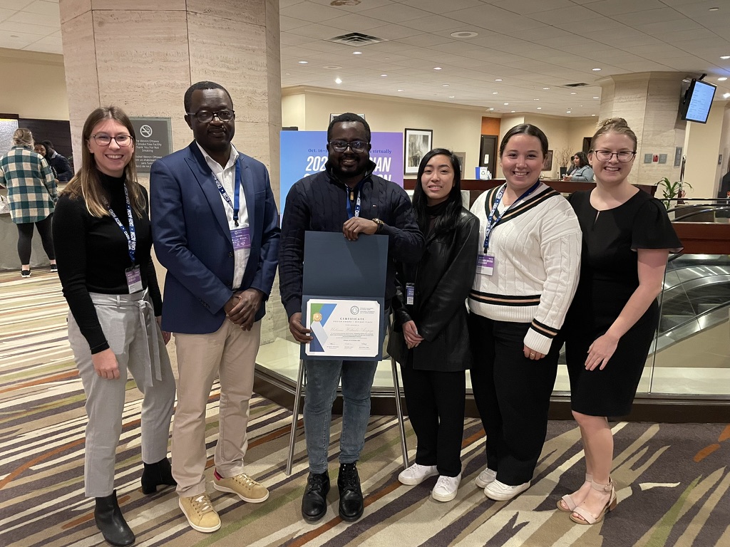 Lab members with the poster award certificate in Ottawa