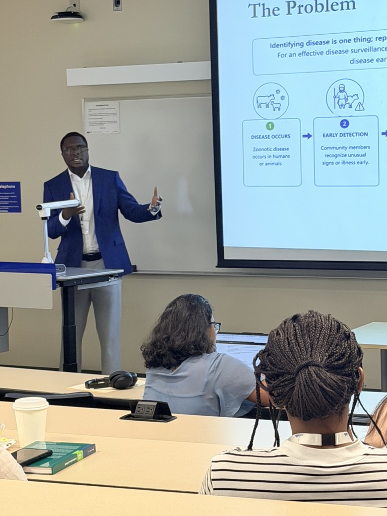 A lab member presenting on early detection of zoonotic disease in communities